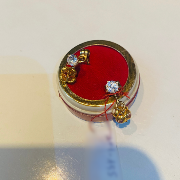 Boucle d'oreille en or en zirconia fleur ombrelle